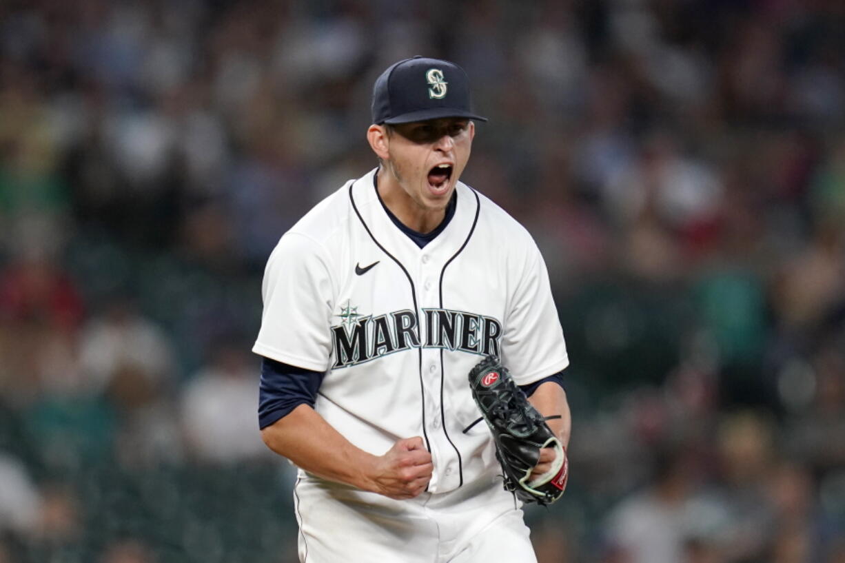 Seattle Mariners starting pitcher Chris Flexen yells after striking out Los Angeles Angels' Taylor Ward to end the top of the seventh inning of a baseball game Saturday, July 10, 2021, in Seattle.