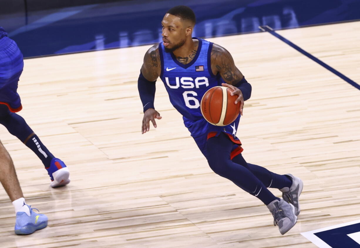 United States' Damian Lillard (6) brings the ball up court against Argentina during the first half of an exhibition basketball game in Las Vegas on Tuesday, July 13, 2021.