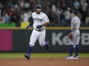 Seattle Mariners' Abraham Toro rounds the bases after hitting a two-run home run against the Houston Astros during the ninth inning of a baseball game, Tuesday, July 27, 2021, in Seattle. Toro was traded to the Mariners from the Astros earlier in the day. The Astros won 8-6. (AP Photo/Ted S.