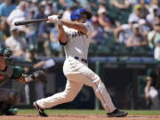 Seattle Mariners' Kyle Seager hits a two-RBI single against the Oakland Athletics during the third inning of a baseball game, Sunday, July 25, 2021, in Seattle. (AP Photo/Ted S.