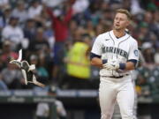 Seattle Mariners' Jarred Kelenic tosses his batting pad after striking out to end the fourth inning of the team's baseball game against the Oakland Athletics, Thursday, July 22, 2021, in Seattle. (AP Photo/Ted S.