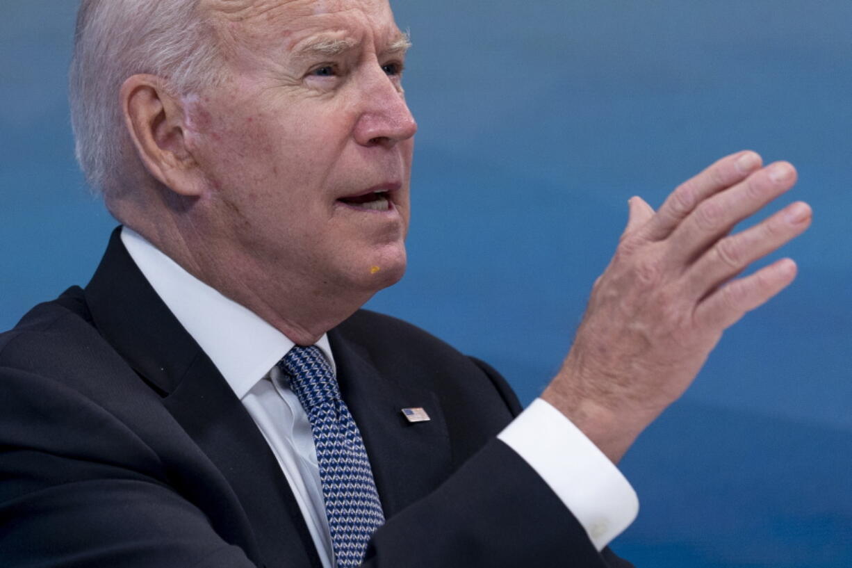 President Joe Biden has something small and yellow on his chin as he speaks during a meeting with governors to discuss ongoing efforts to strengthen wildfire prevention, preparedness and response efforts, and hear firsthand about the ongoing impacts of the 2021 wildfire season in the South Court Auditorium in the Eisenhower Executive Office Building on the White House Campus in Washington, Friday, July 30, 2021. An aide passed the president a note alerting him of something on his face and he wiped it away.