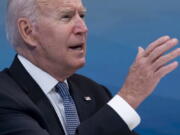 President Joe Biden has something small and yellow on his chin as he speaks during a meeting with governors to discuss ongoing efforts to strengthen wildfire prevention, preparedness and response efforts, and hear firsthand about the ongoing impacts of the 2021 wildfire season in the South Court Auditorium in the Eisenhower Executive Office Building on the White House Campus in Washington, Friday, July 30, 2021. An aide passed the president a note alerting him of something on his face and he wiped it away.