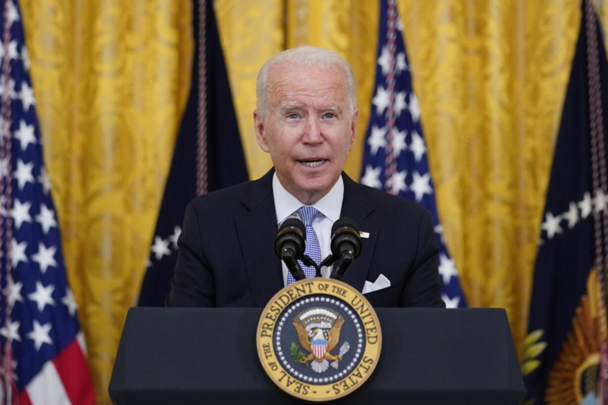 President Joe Biden announces from the East Room of the White House in Washington, Thursday, July 29, 2021, that millions of federal workers must show proof they've received a coronavirus vaccine or submit to regular testing and stringent social distancing, masking and travel restrictions in an order to combat the spread of the coronavirus. A new poll from The Associated Press-NORC Center for Public Affairs Research finds 6 in 10 Democrats say they're optimistic about their party's future. And Democrats nearly universally approve of the way President Joe Biden is handling his job.