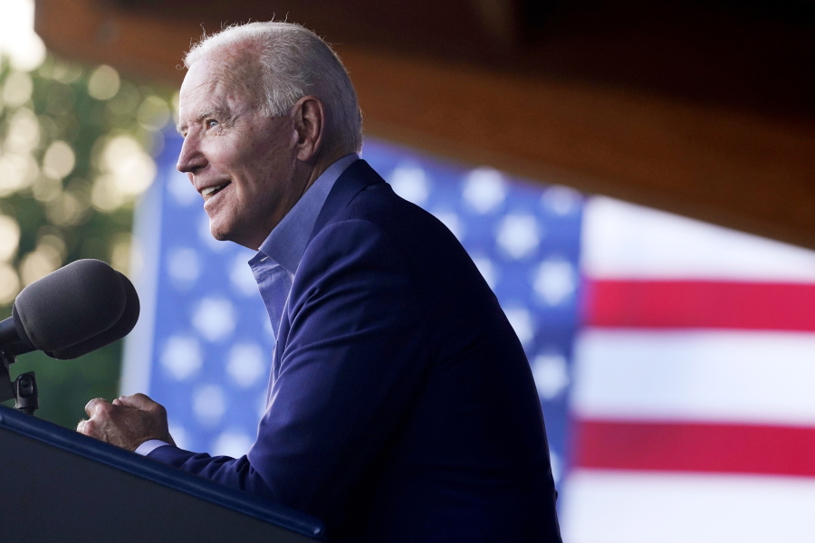 In this July 23, 2021 photo, President Joe Biden speaks at a campaign event for Virginia democratic gubernatorial candidate Terry McAuliffe at Lubber Run Park in Arlington, Va.  Biden will make his first visit to an agency of the U.S. intelligence community under sharply different circumstances than his predecessor, who often railed against the so-called "deep state" and openly questioned its conclusions. Biden is scheduled Tuesday afternoon to visit the Office of the Director of National Intelligence, which by law oversees the nation's 17 intelligence organizations.