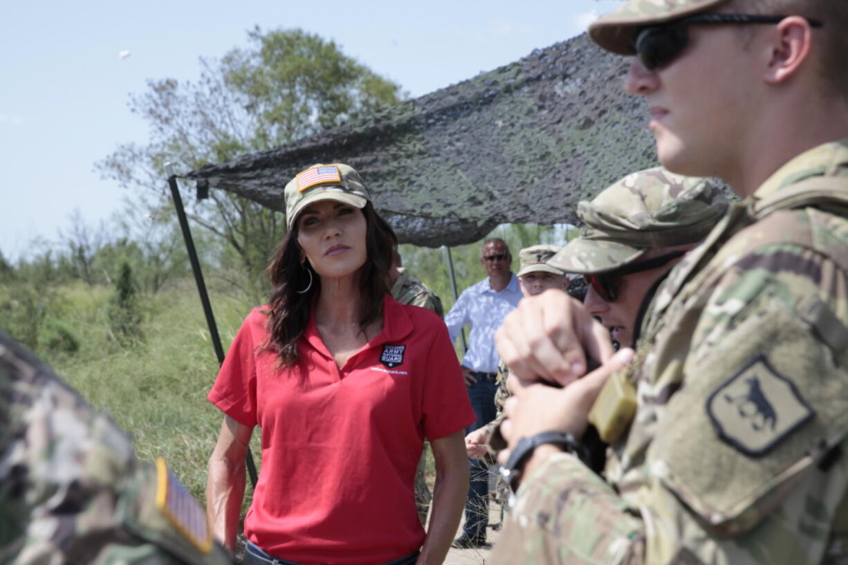 South Dakota Gov. Kristi Noem visits the U.S. border with Mexico on Monday, July 26, 2021, near McAllen, Texas. The Republican governor deployed roughly 50 National Guard troops to help with Texas' push to arrest people crossing illegally and charge them with state crimes.