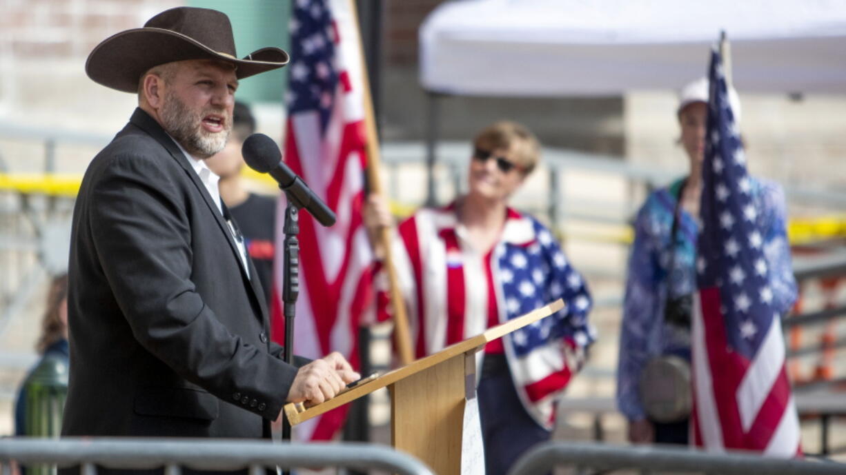 FILE - In this April 3, 2021 file photo Ammon Bundy speaks to a crowd of about 50 followers in front of the Ada County Courthouse, in downtown Boise. The anti-government activist has asked a judge to throw out the guilty verdict in his trespassing case and to acquit him instead because he says the state's trespassing law should not be applied to public property. Idaho's courts, like many states, allow defendants to ask the judge for an acquittal within several days of the jury verdict.