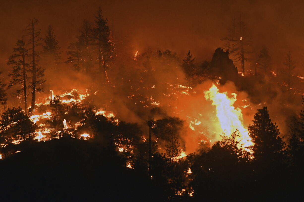 Flames from the Lava Fire burn along a ridge near U.S. Highway 97 and Big Springs Road north of Weed, Calif., on Monday, June 28, 2021.