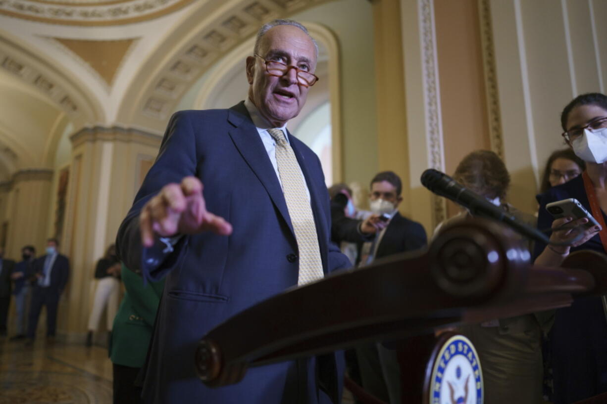 Senate Majority Leader Chuck Schumer, D-N.Y., speaks to reporters as intense negotiations continue to salvage a bipartisan infrastructure deal, at the Capitol in Washington, Tuesday, July 27, 2021. (AP Photo/J.