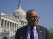 Senate Majority Leader Chuck Schumer, D-N.Y., arrives to meet with Speaker of the House Nancy Pelosi, D-Calif., before an event to promote investments in clean jobs, at the Capitol in Washington, Wednesday, July 28, 2021. (AP Photo/J.