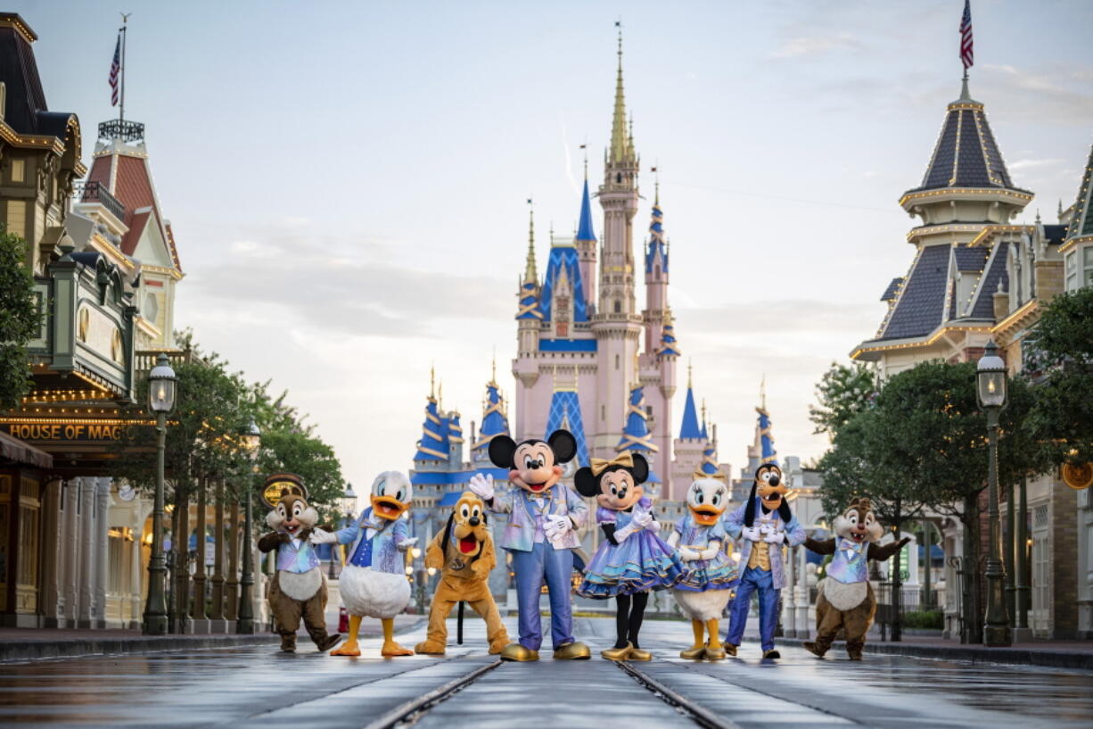 This undated photo provided by Walt Disney World shows Disney characters at Walt Disney World in Lake Buena Vista, Fla. Walt Disney World is planning an 18-month celebration in honor of its 50th anniversary, starting in October 2021.