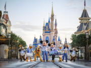 This undated photo provided by Walt Disney World shows Disney characters at Walt Disney World in Lake Buena Vista, Fla. Walt Disney World is planning an 18-month celebration in honor of its 50th anniversary, starting in October 2021.