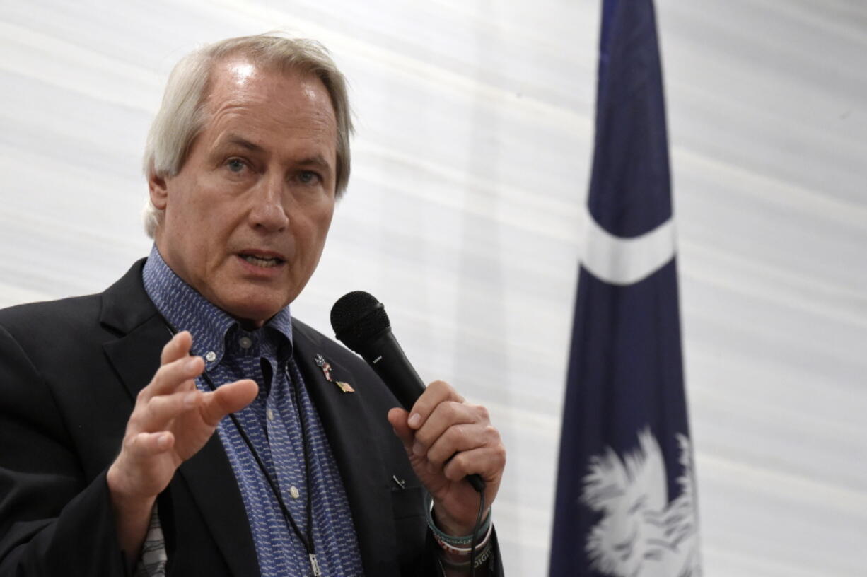 FILE - In this April 30, 2021, file photo, pro-Trump attorney L. Lin Wood, a candidate for chairman of the South Carolina Republican Party, speaks to attendees of the Richland County GOP convention in Columbia, S.C. A federal judge is considering whether to order financial penalties or other sanctions against some of former President Donald Trump's lawyers, including Wood, who signed onto a lawsuit last year challenging Michigan's election results.