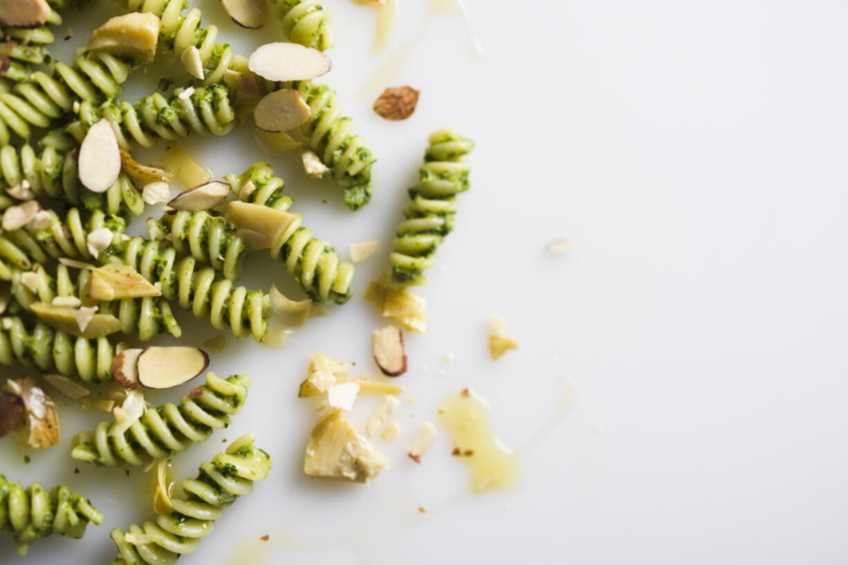 A recipe for fusilli with fresh herbs and artichokes.