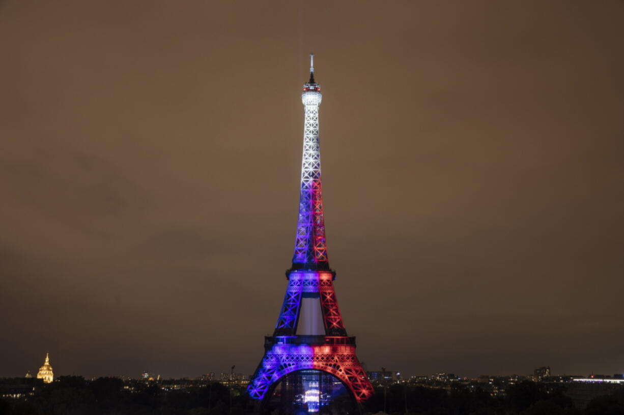 Fireworks illuminate the Eiffel Tower in Paris during Bastille Day celebrations late Wednesday, July 14, 2021. France celebrated its national holiday Wednesday with thousands of troops marching in a Paris parade, after last year's events were scaled back because of COVID-19 virus fears.