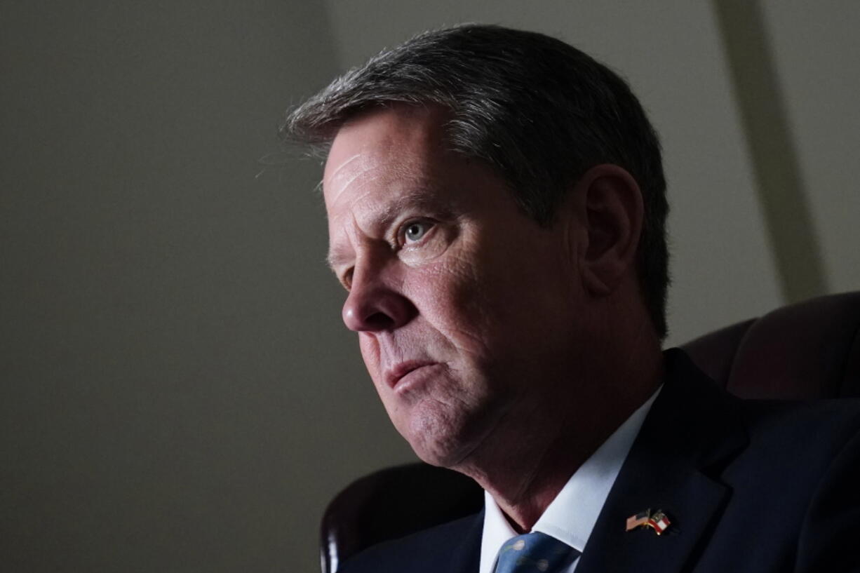 In this July 7, 2021, photo Georgia Gov. Brian Kemp speaks during an interview at his campaign office in Atlanta.  Kemp's office says it was surprised to hear federal officials were reevaluating its plan to overhaul how state residents buy health insurance under the Affordable Care Act. The director of Kemp's Office of Health Strategy and Coordination said in a recent letter that the move by the Biden administration suggests it wants to revisit the plan's approval, which he said is not allowed.