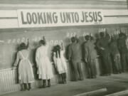 Students write on a chalkboard in the 1910s at the Red Deer Indian Industrial School in Alberta. In Canada, where more than 150,000 Indigenous children attended residential schools over more than a century, a National Truth and Reconciliation Commission identified 3,201 deaths amid poor conditions.