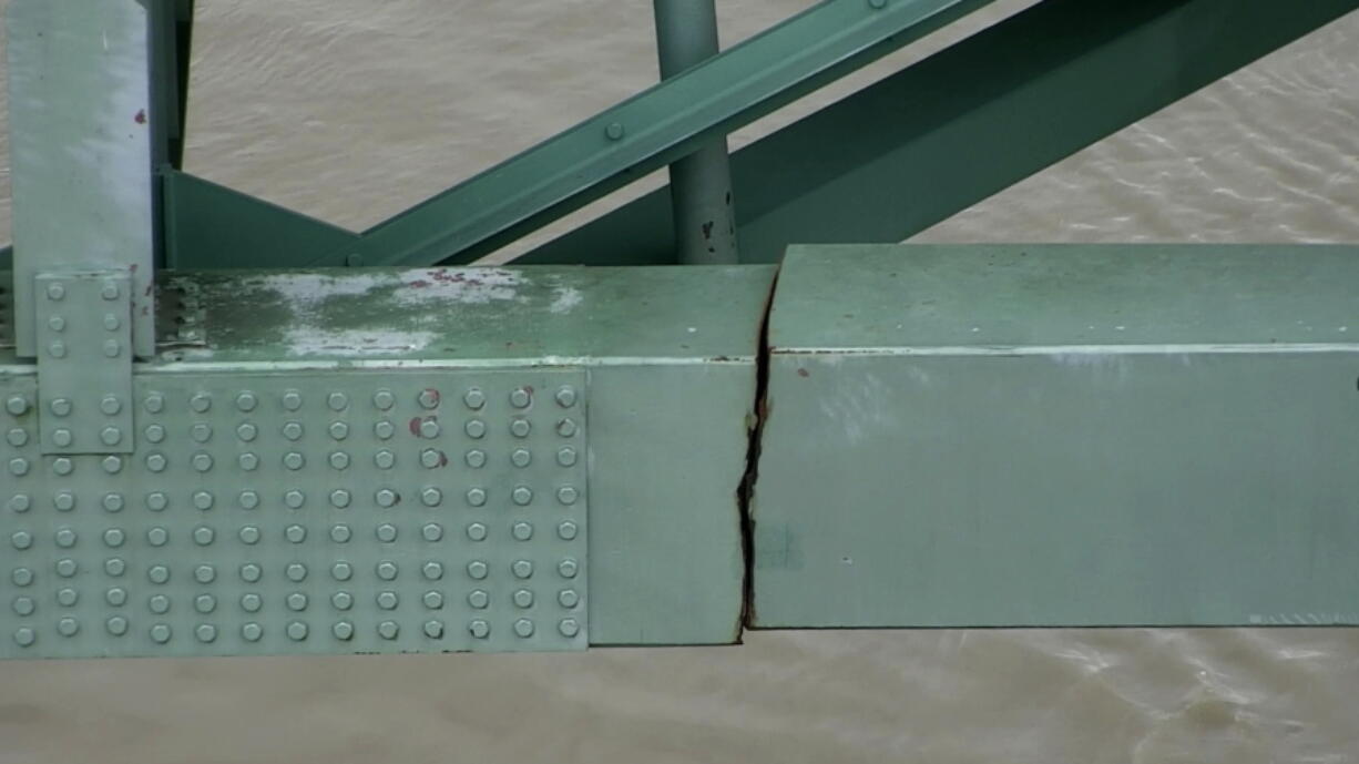 FILE - This undated photo released by the Tennessee Department of Transportation shows a crack in a steel beam on the Interstate 40 bridge, near Memphis, Tenn. The Interstate 40 bridge linking Arkansas and Tennessee that was closed after a crack was found in the span will begin reopening next week. Transportation officials on Wednesday, July 28, 2021, said the eastbound lanes of the Hernando DeSoto Bridge over the Mississippi River will reopen to limited traffic on Monday morning.