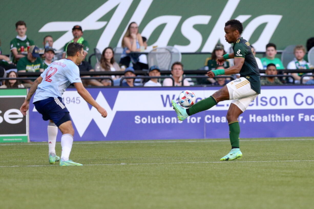 Portland Timbers forward Jeremy Ebobisse, right, balances the ball on his foot during an MLS match against FC Dallas, Saturday, July 17, 2021.