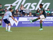 Portland Timbers forward Jeremy Ebobisse, right, balances the ball on his foot during an MLS match against FC Dallas, Saturday, July 17, 2021.