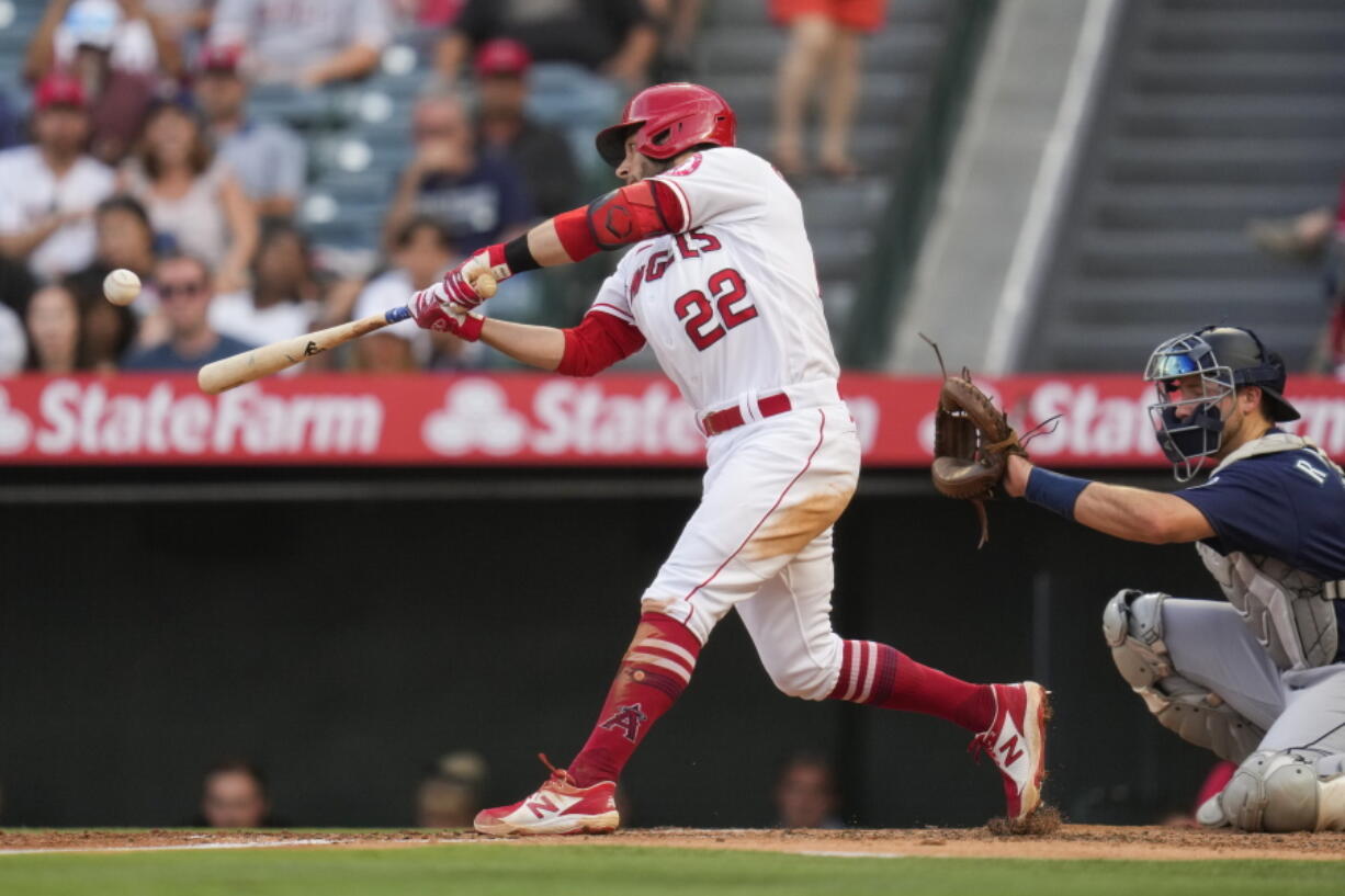 Los Angeles Angels' David Fletcher (22) doubles during the second inning of a baseball game against the Seattle Mariners Saturday, July 17, 2021, in Anaheim, Calif. Taylor Ward, Juan Lagares, and Jack Mayfield scored.