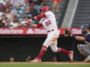 Los Angeles Angels' David Fletcher (22) doubles during the second inning of a baseball game against the Seattle Mariners Saturday, July 17, 2021, in Anaheim, Calif. Taylor Ward, Juan Lagares, and Jack Mayfield scored.