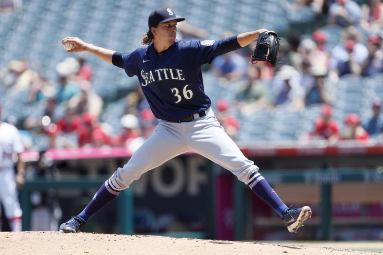 Seattle Mariners starting pitcher Logan Gilbert throws to a Los Angeles Angels batter during the first inning of a baseball game in Anaheim, Calif., Sunday, July 18, 2021.