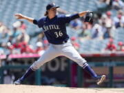 Seattle Mariners starting pitcher Logan Gilbert throws to a Los Angeles Angels batter during the first inning of a baseball game in Anaheim, Calif., Sunday, July 18, 2021.