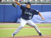 Seattle Mariners starting pitcher Yusei Kikuchi throws to the Toronto Blue Jays during the first inning. (Jeffrey T.