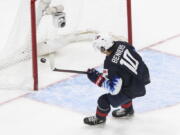 Playing for the United States, Matthew Beniers (10) scores an empty net goal against Slovakia during the World Junior Hockey championship game in Jan. 2, 2021. He became the Seattle Kraken's first-ever draft pick, going No. 2 overall on Friday, July 23, 2021.