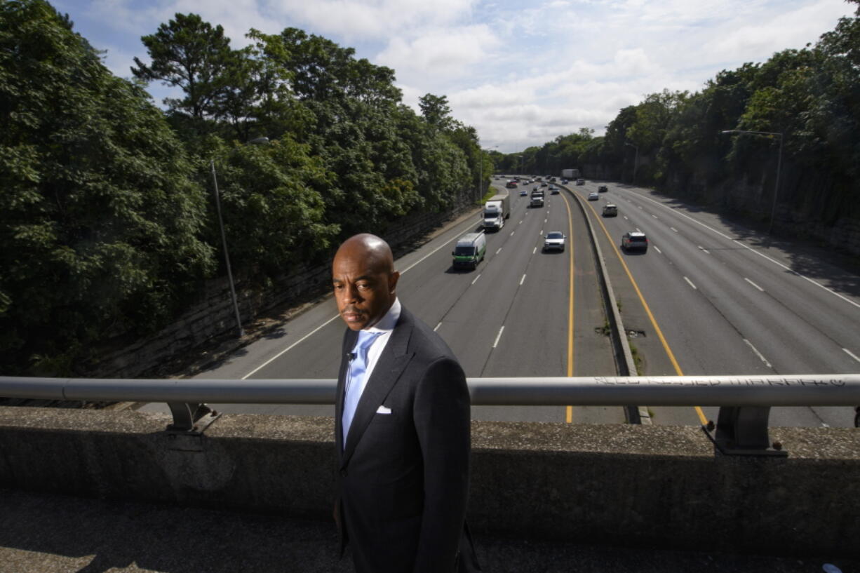 Tennessee State Rep. Harold Love, Jr. stands on an overpass over I-40, Monday, July, 19, 2021, near the site of his family's former home on the north side of Nashville, Tenn. Love Jr.'s father, a Nashville city councilman, was forced to sell his home near here to make way for the highway, but put up a fight in the 1960s against the rerouting of Interstate 40 because he believed it would stifle and isolate Nashville's Black community. Love Jr. is now part of a group pushing to build a cap across the highway, behind him, that creates a community space to help reunify the city.