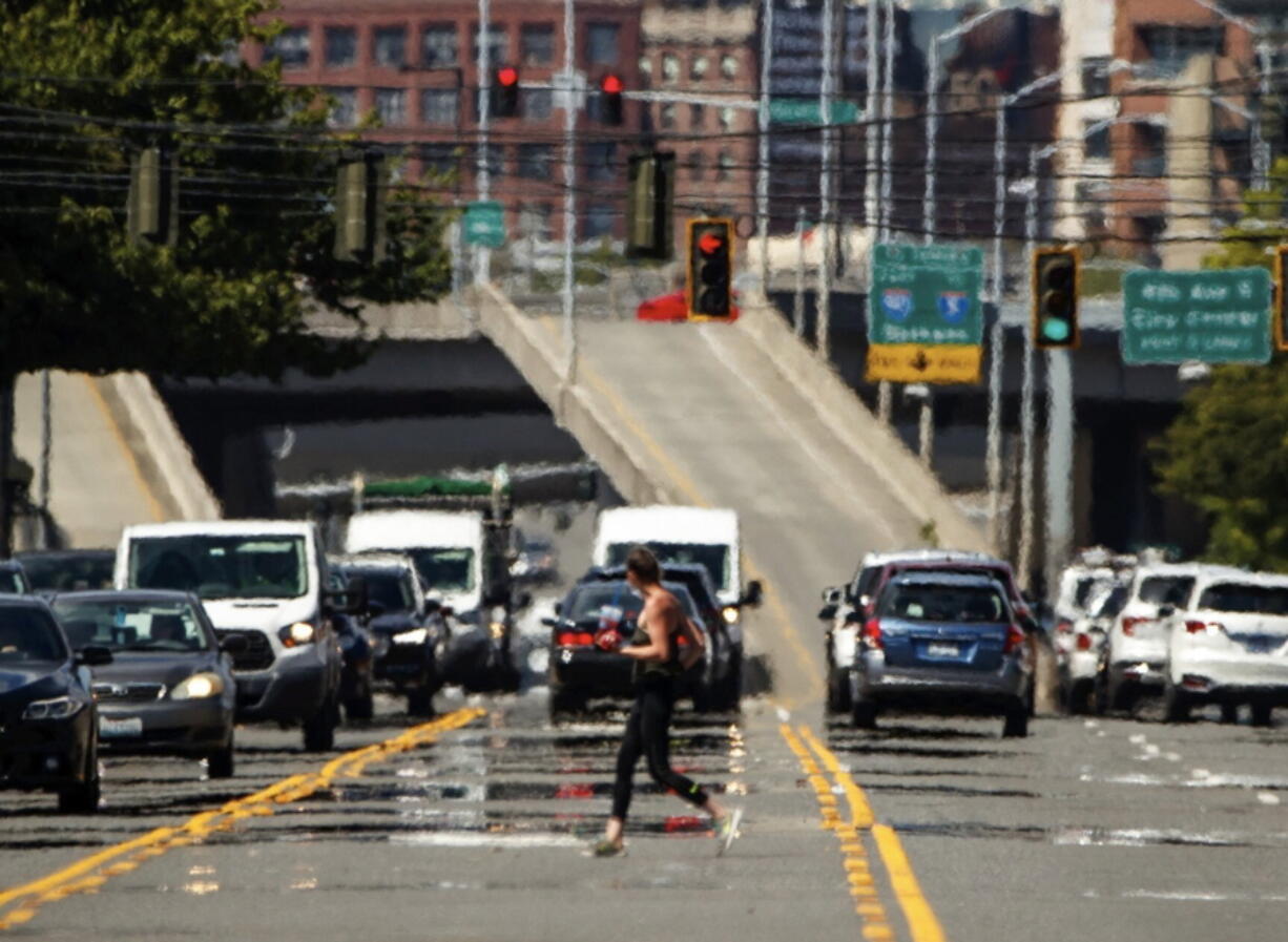 Heat waves distort a street scene in the Sodo neighborhood of Seattle on Wednesday.