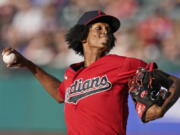 Cleveland Indians starting pitcher Triston McKenzie delivers in the first inning of a baseball game against the Kansas City Royals, Friday, July 9, 2021, in Cleveland.