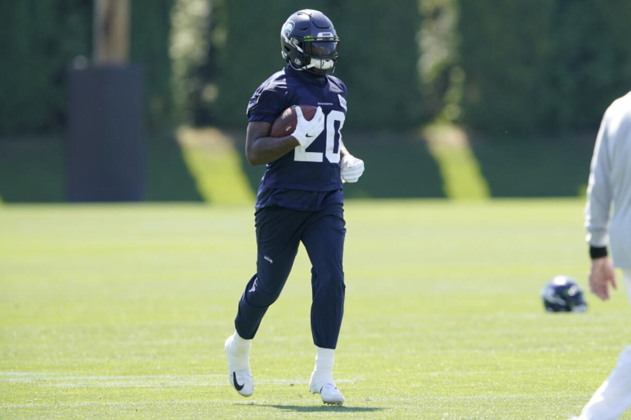 Seattle Seahawks running back Rashaad Penny carries the ball during NFL football practice Thursday, July 29, 2021, in Renton, Wash. (AP Photo/Ted S. Warren) (Ted S.