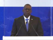 In this image from video provided by IISS, U.S. Defense Secretary Lloyd J. Austin delivers a speech during the 40th IISS Fullerton Lecture Tuesday, July 27, 2021 in Singapore. Austin decried the actions of Myanmar's military rulers as unacceptable on Tuesday, while urging a regional bloc to keep demanding an end to violence. Austin also applauded the Association of Southeast Asian nations for its efforts on the issue, which included forging a consensus with Myanmar's military leader in April.