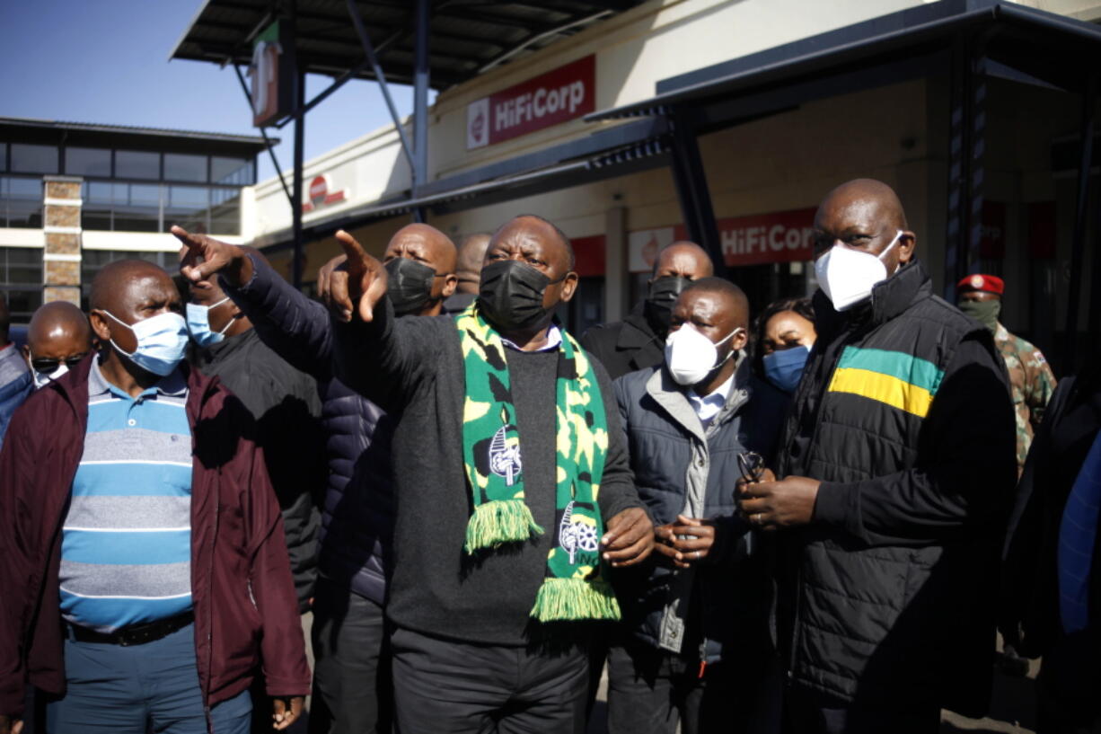 South African President Cyril Ramaphosa, on a visit to Soweto, South Africa, Sunday July 18 2021. Ramaphosa went to Johannesburg's Soweto township to view badly damaged retail centers where people were trampled to death in rioting sparked by the imprisonment of former President Jacob Zuma.