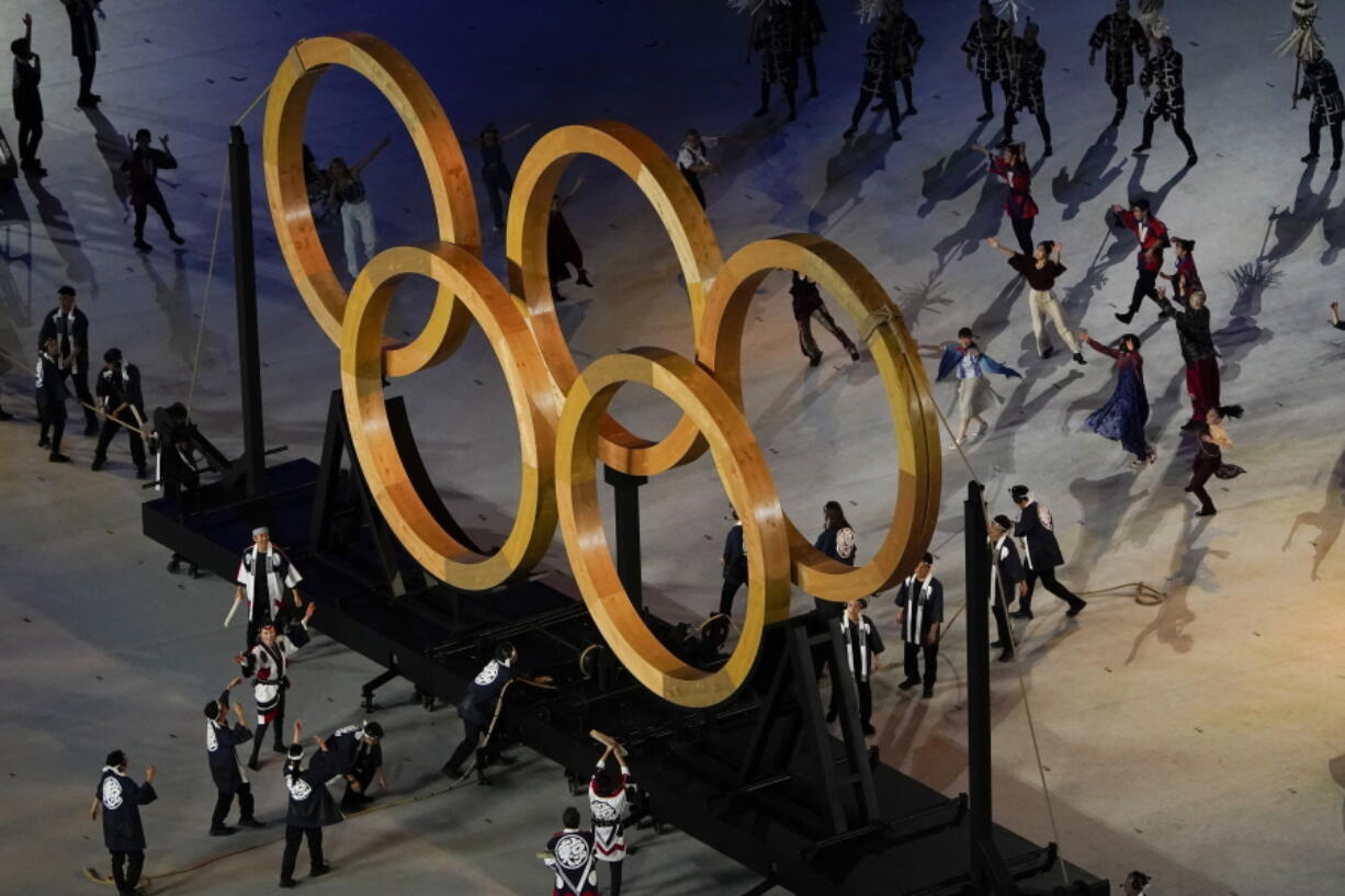 Actors perform during the opening ceremony at the Olympic Stadium at the 2020 Summer Olympics, Friday, July 23, 2021, in Tokyo.