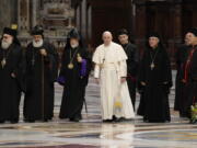 The Patriarch of the Syriac Orthodox Church, Moran Mor Ignatius Aphrem II, second from left, the head of the Catholicosate of the Great House of Cilicia of the Armenian Apostolic Church, Aram I, third from left, Pope Francis, fourth from left, Cardinal Bechara Boutros al-Rahi, firfth from left, Patriarch of Antioch and All the East for the Syriac Catholic Church, Ignatius Youssef III Younan, right, arrive in St. Peter's Basilica to attend a prayer for Lebanon at the Vatican, Thursday, July 1, 2021.