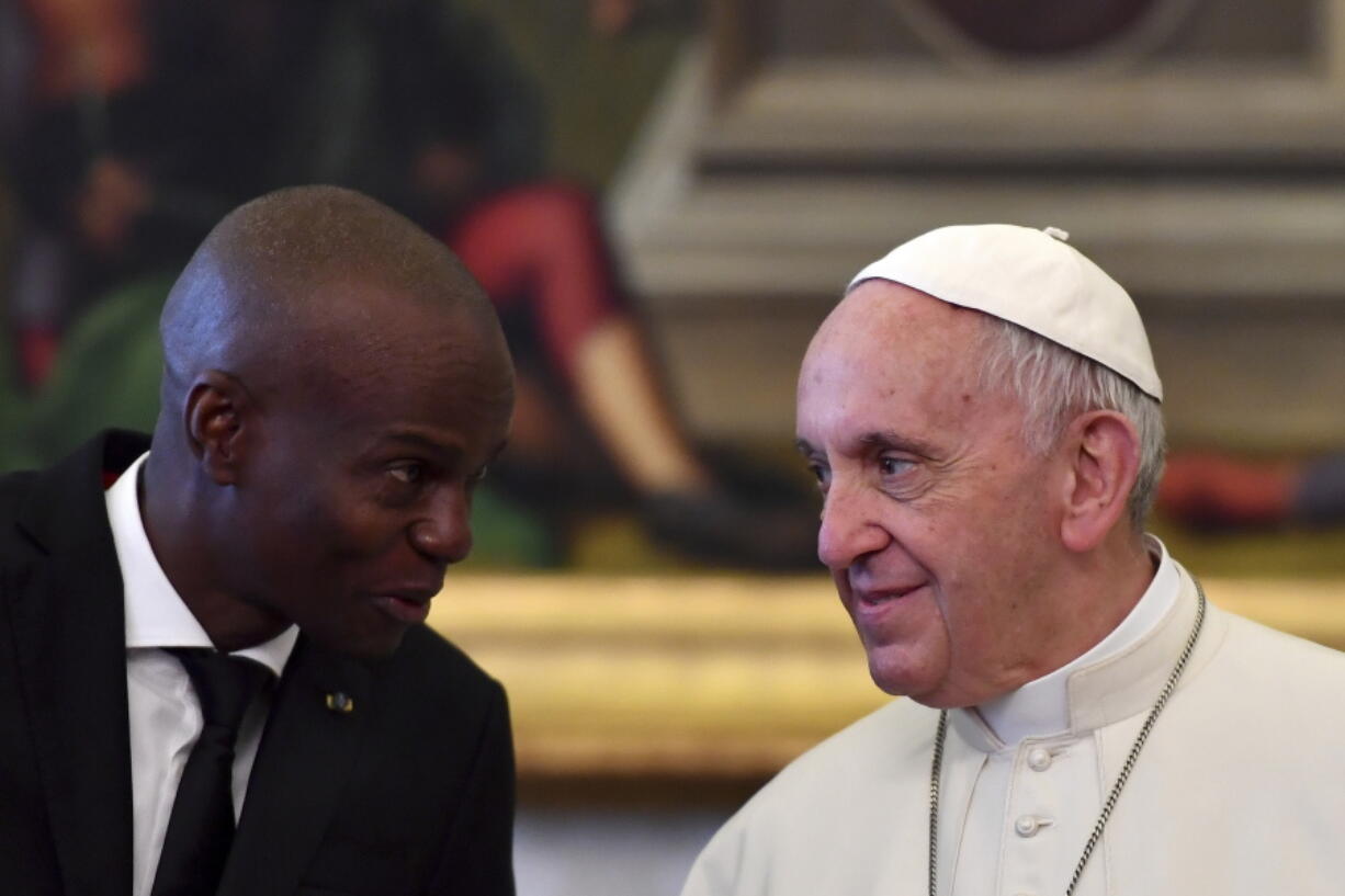 FILE - In this Jan. 26, 2018 file photo, Haiti President Jovenel Moise meets with Pope Francis during a private audience at the Vatican. Pope Francis is sending condolences from the hospital to Haiti following what he said was the "heinous assassination" of its president.