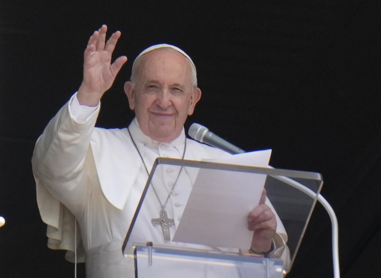 FILE - In this Sunday, July 4, 2021 file photo, Pope Francis waves to the crowd as he arrives to recite the Angelus noon prayer from the window of his studio overlooking St.Peter's Square, at the Vatican. In a brief announcement Sunday afternoon the Vatican said Pope Francis has gone to a Rome hospital for scheduled surgery for a stenosis, or restriction, of the large intestine.