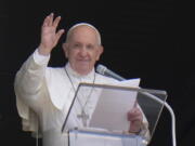 FILE - In this Sunday, July 4, 2021 file photo, Pope Francis waves to the crowd as he arrives to recite the Angelus noon prayer from the window of his studio overlooking St.Peter's Square, at the Vatican. In a brief announcement Sunday afternoon the Vatican said Pope Francis has gone to a Rome hospital for scheduled surgery for a stenosis, or restriction, of the large intestine.