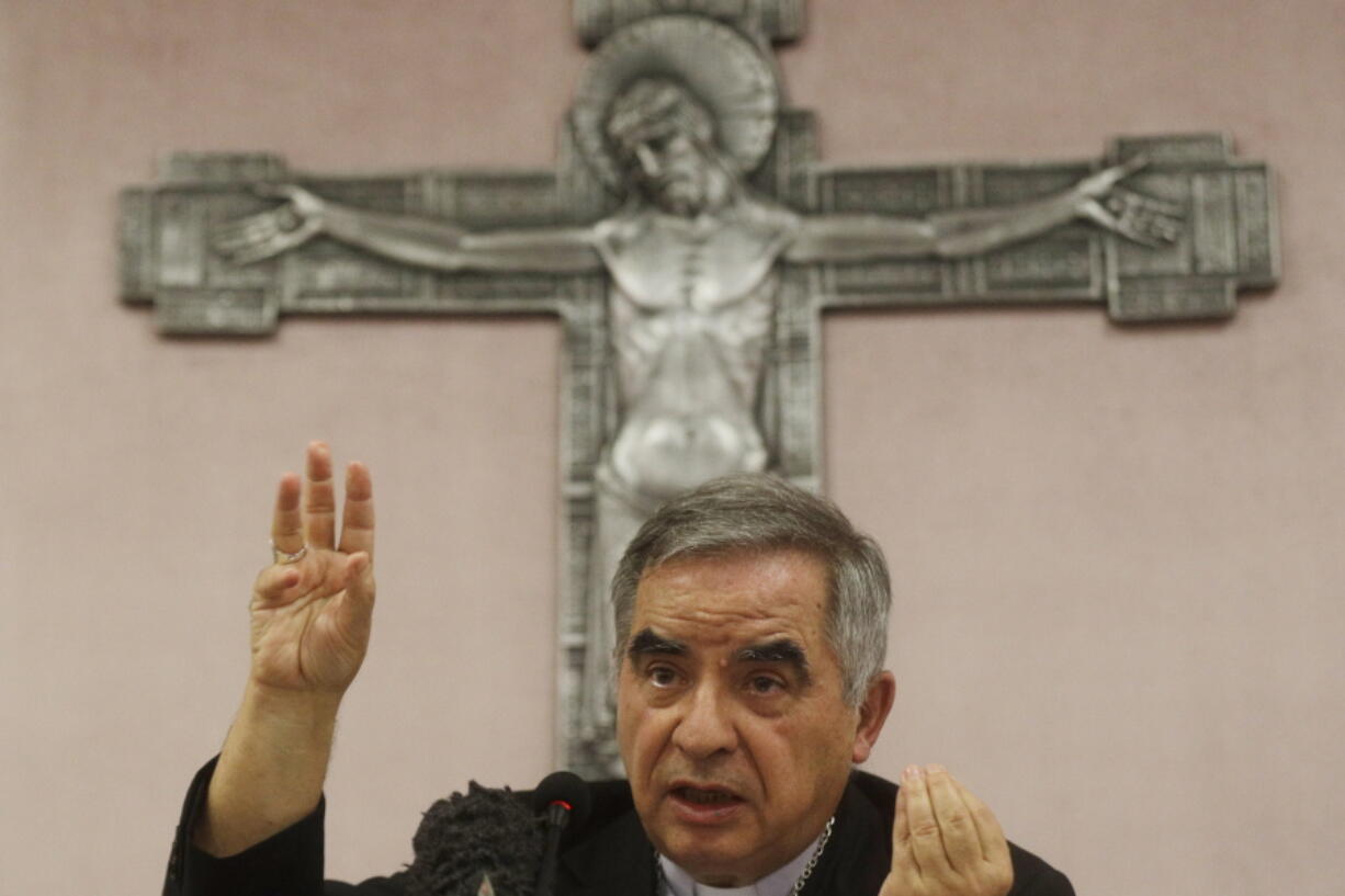 FILE - In this Friday, Sept. 25, 2020 file photo, Cardinal Angelo Becciu talks to journalists during press conference in Rome. A trial is slated to begin on Tuesday, July 27, 2021 within the Vatican City's imposing walls of 10 defendants, including once-powerful cardinal Becciu, in a case based on a sprawling probe into the allegedly criminal management of the Holy See's portfolio of assets, including donations by countless Catholics from the pews.