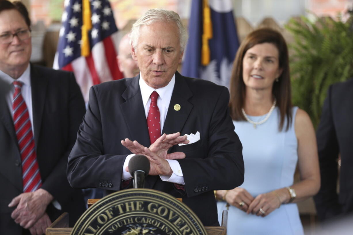 FILE - In this June 24, 2021, file photo, South Carolina Gov. Henry McMaster speaks during a ceremony to sign a bill preventing people from suing businesses over COVID-19 on Thursday, at Cafe Strudel in West Columbia, S.C.  McMaster is one of several Republican state leaders opposing federal efforts to go door-to-door to urge people to get vaccinated against COVID-19.