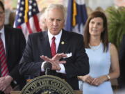 FILE - In this June 24, 2021, file photo, South Carolina Gov. Henry McMaster speaks during a ceremony to sign a bill preventing people from suing businesses over COVID-19 on Thursday, at Cafe Strudel in West Columbia, S.C.  McMaster is one of several Republican state leaders opposing federal efforts to go door-to-door to urge people to get vaccinated against COVID-19.