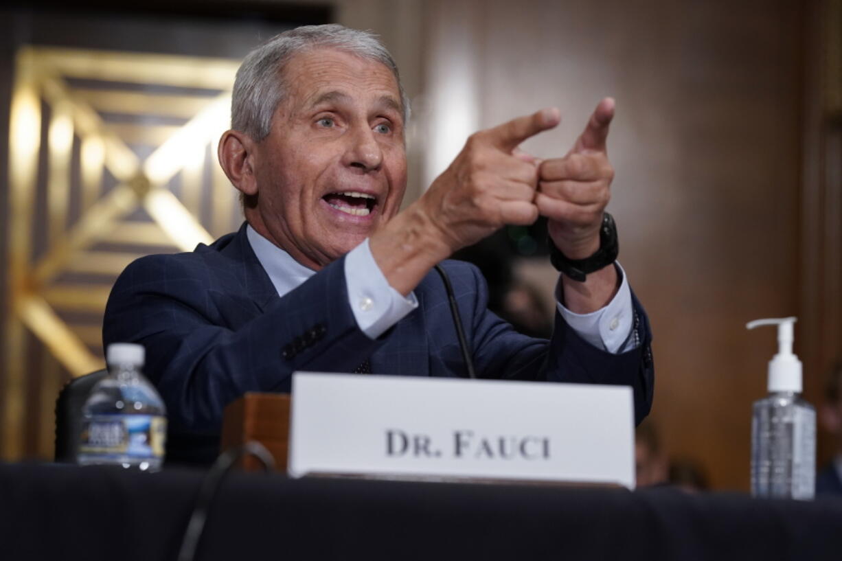 Top infectious disease expert Dr. Anthony Fauci responds to accusations by Sen. Rand Paul, R-Ky., as he testifies before the Senate Health, Education, Labor, and Pensions Committee about the origin of COVID-19, on Capitol Hill in Washington, Tuesday, July 20, 2021. Cases of COVID-19 have tripled over the past three weeks, and hospitalizations and deaths are rising among unvaccinated people. (AP Photo/J.