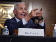 Top infectious disease expert Dr. Anthony Fauci responds to accusations by Sen. Rand Paul, R-Ky., as he testifies before the Senate Health, Education, Labor, and Pensions Committee about the origin of COVID-19, on Capitol Hill in Washington, Tuesday, July 20, 2021. Cases of COVID-19 have tripled over the past three weeks, and hospitalizations and deaths are rising among unvaccinated people. (AP Photo/J.