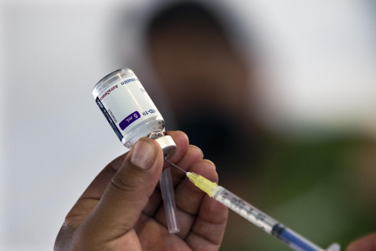 A health worker prepares to administer a jab of the AstraZeneca COVID-19 vaccine during a vaccination drive for people ages 30 to 39 in Mexico City, Wednesday, July 7, 2021.