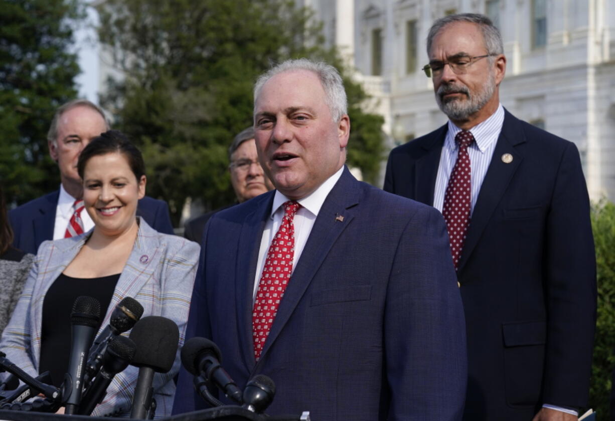 House Minority Whip Steve Scalise, R-La., joined by House Republican Conference Chair Elise Stefanik, R-N.Y., left, and members of the GOP Doctors Caucus, speaks during a news conference about the Delta variant of COVID-19 and the origin of the virus, at the Capitol in Washington, Thursday, July 22, 2021. (AP Photo/J.