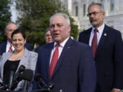 House Minority Whip Steve Scalise, R-La., joined by House Republican Conference Chair Elise Stefanik, R-N.Y., left, and members of the GOP Doctors Caucus, speaks during a news conference about the Delta variant of COVID-19 and the origin of the virus, at the Capitol in Washington, Thursday, July 22, 2021. (AP Photo/J.