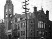 About 15 years before this photo was taken of the old Clark County Courthouse, it was invaded by three members of the Columbia Klan No. 1 supposedly on a mission of mercy. Although the men wanted to fulfill a crippled boy’s request for leg braces, their assault was at odds with this intent and alarmed the courthouse staff, including a deputy sheriff. While the Klan had been operating in Oregon for several months, this was the first public appearance of uniformed Ku Klux Klansmen in the county.